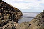Lava Spalten in den Ozean, Giants Causeway gebadet, Nord-Irland.