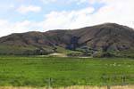 Berge und Schafe, Queenstown Road to Invercargill, Southland, Neuseeland.