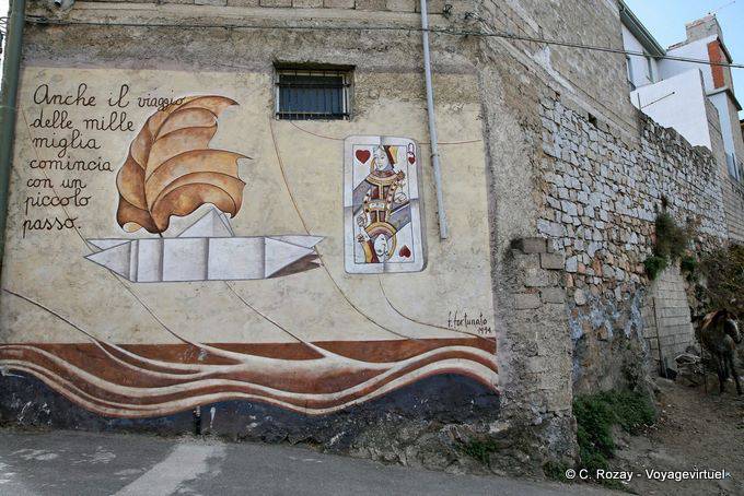 Orgosolo, die Reise von tausend Meilen beginnt mit einem kleinen Schritt, Fortunato, Wandmalerei - Sardinien