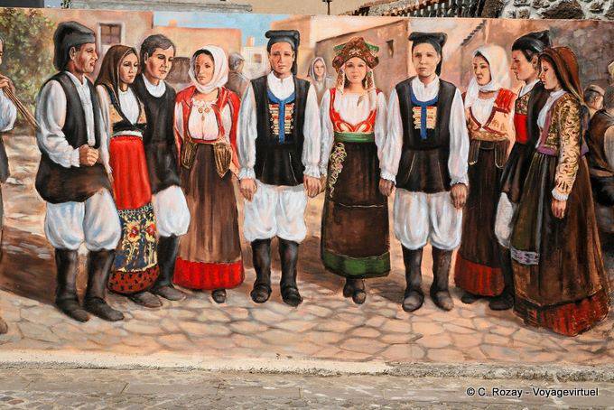 Tinnura, eine Volksgruppe im Kostüm, Wandmalerei Via S. Satta - Sardinien
